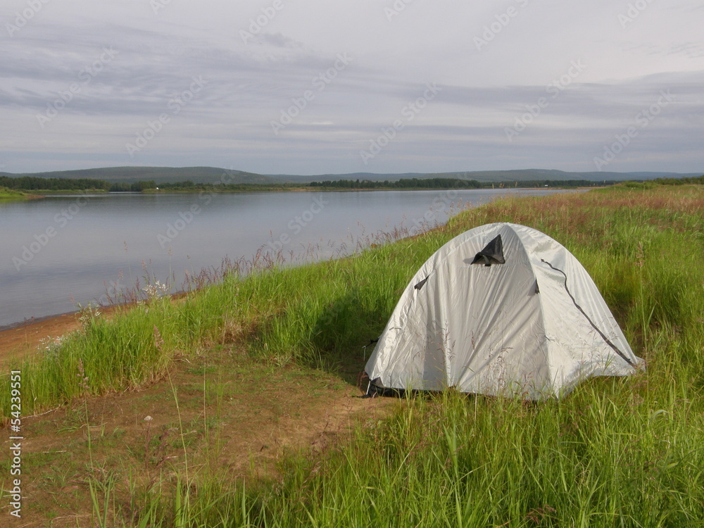 Camping tent on the bank of Torniojoki river, northern Finland