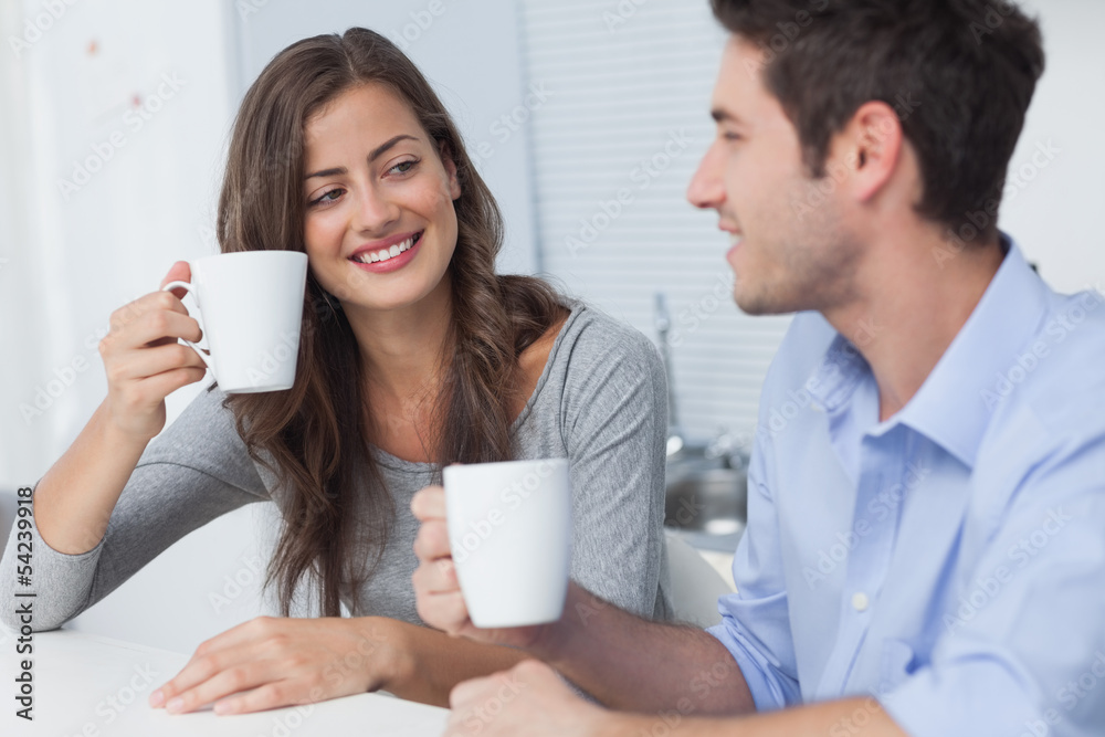 Beautiful couple drinking a cup of coffee Beautiful couple drinking a cup of coffee
