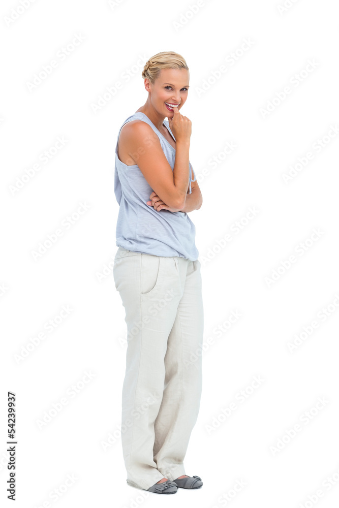 Woman looking at camera and biting finger Woman looking at camera and biting finger