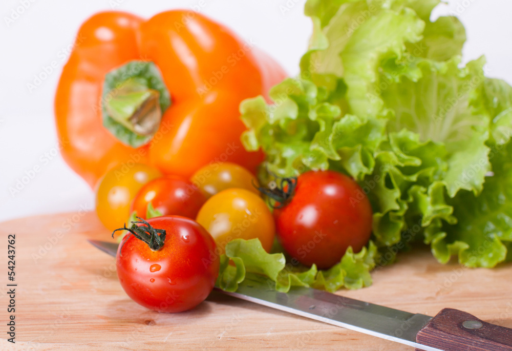 Vegetables on the chopping board and knife Vegetables on the chopping board and knife