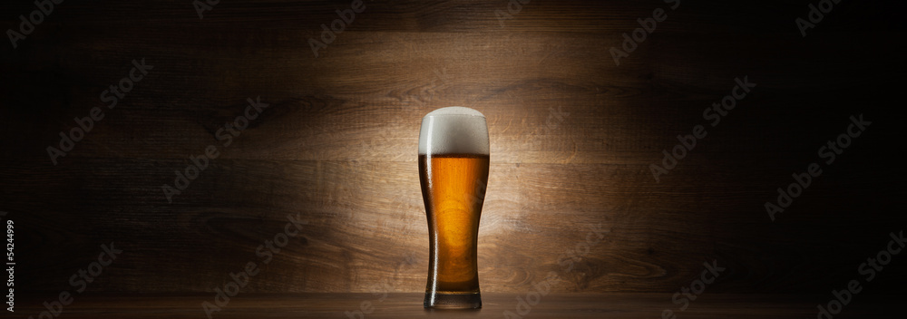 glass beer on wood background with copyspace