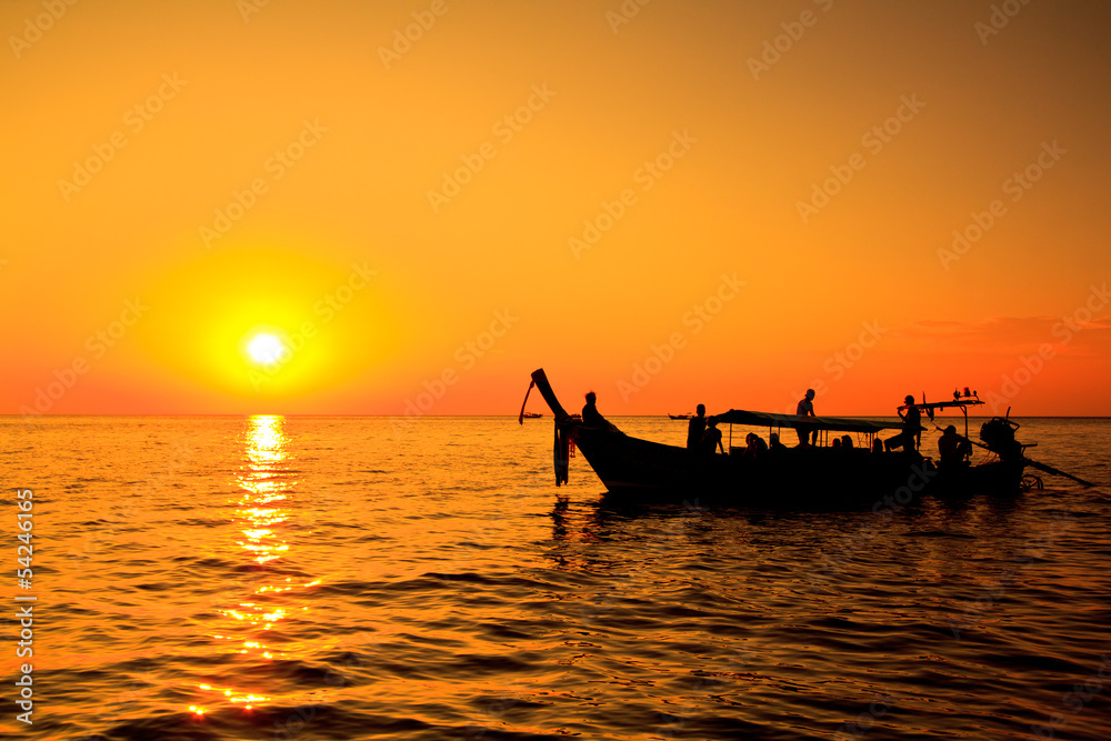 Boat in the sea with sunset sky
