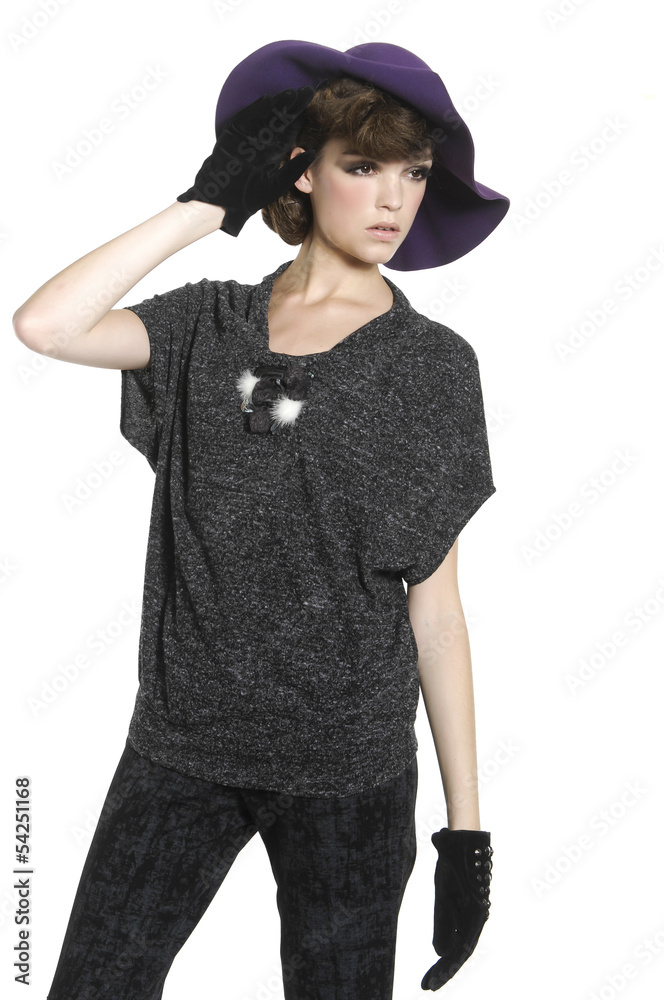fashion casual girl in black gloves standing with hat posing fashion casual girl in black gloves standing with hat posing
