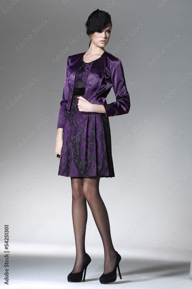 Full length young fashion model walking in studio Full length young fashion model walking in studio