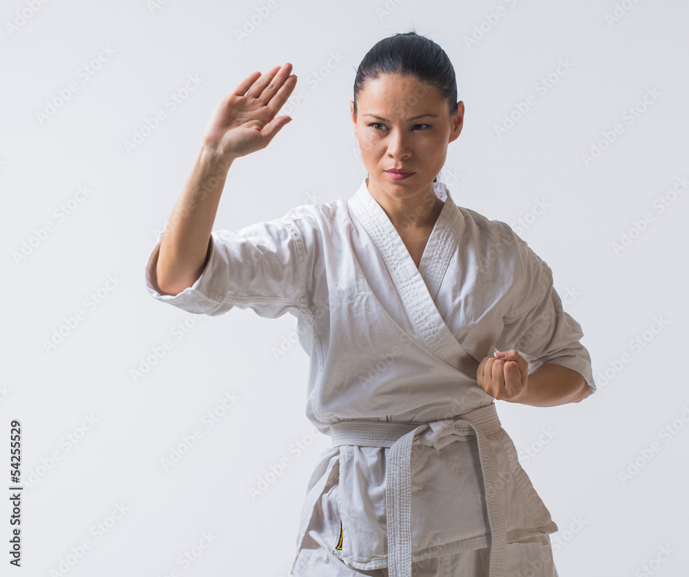 Asian woman in kimono show block in martial art exercise Asian woman in kimono show block in martial art exercise