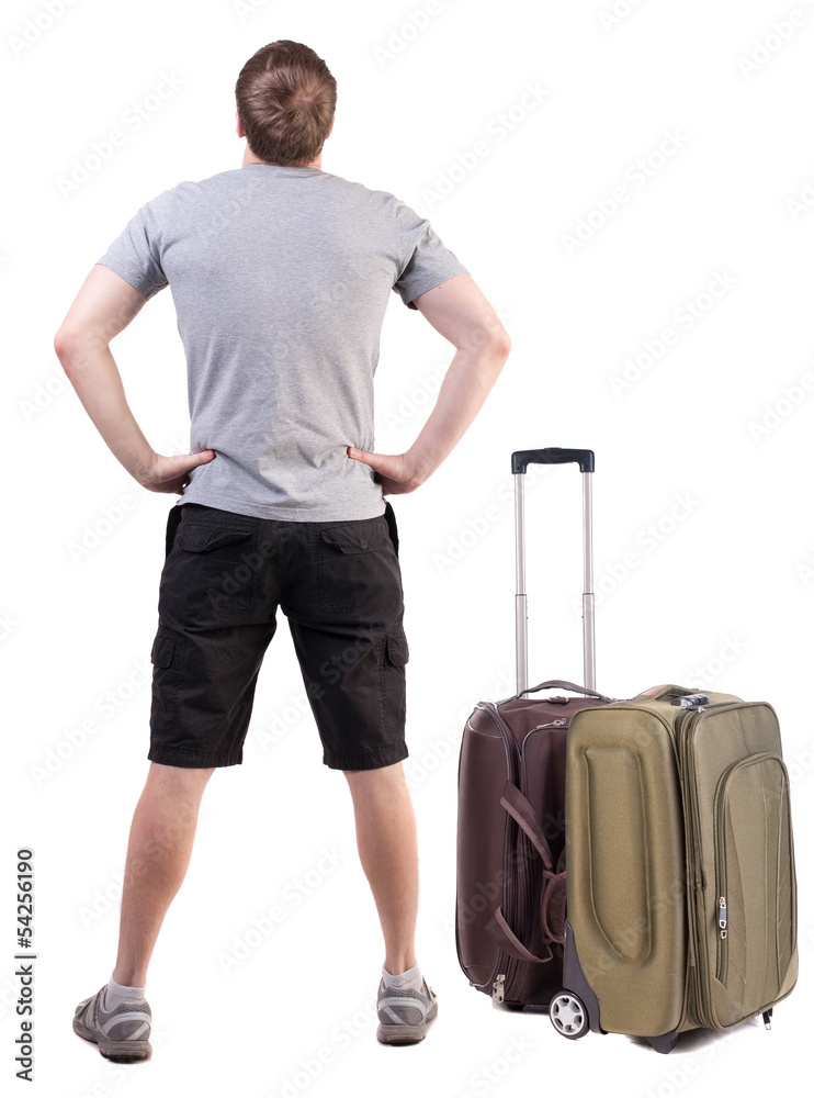 Back view of traveling man with suitcase looking up. Back view of traveling man with suitcase looking up.
