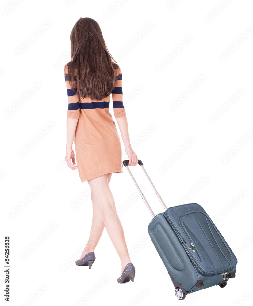 back view of walking woman with suitcase back view of walking woman with suitcase