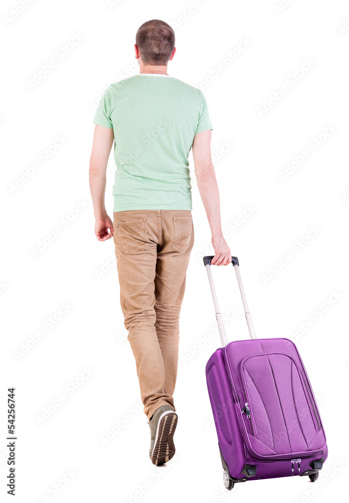 back view of walking  man  with suitcase.