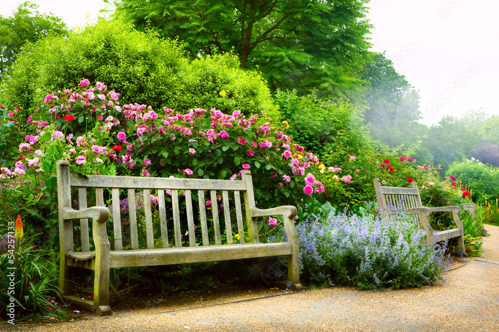 Art bench and flowers in the morning in an English park - obrazy, fototapety, plakaty 
