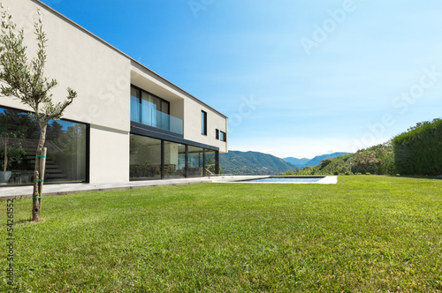 Modern villa with pool, view from the garden