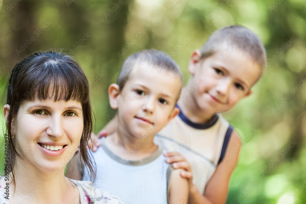 Mother and sons walking outdoor Mother and sons walking outdoor