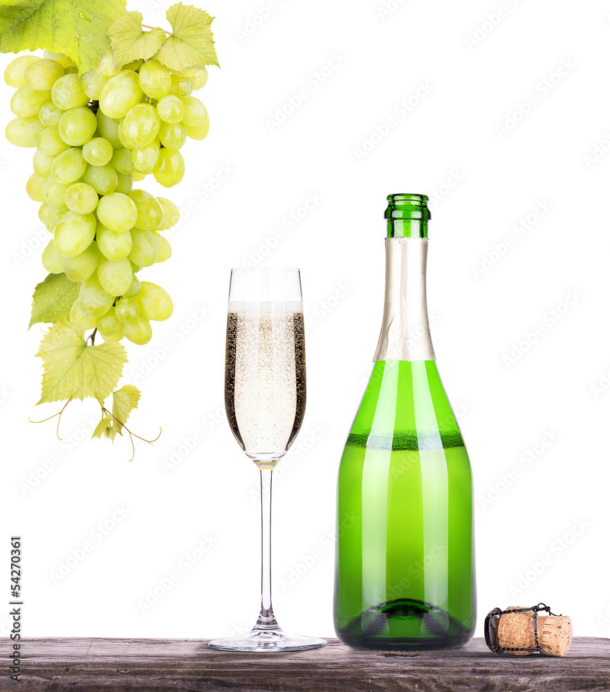 grapes  with bottle of champagne and glass