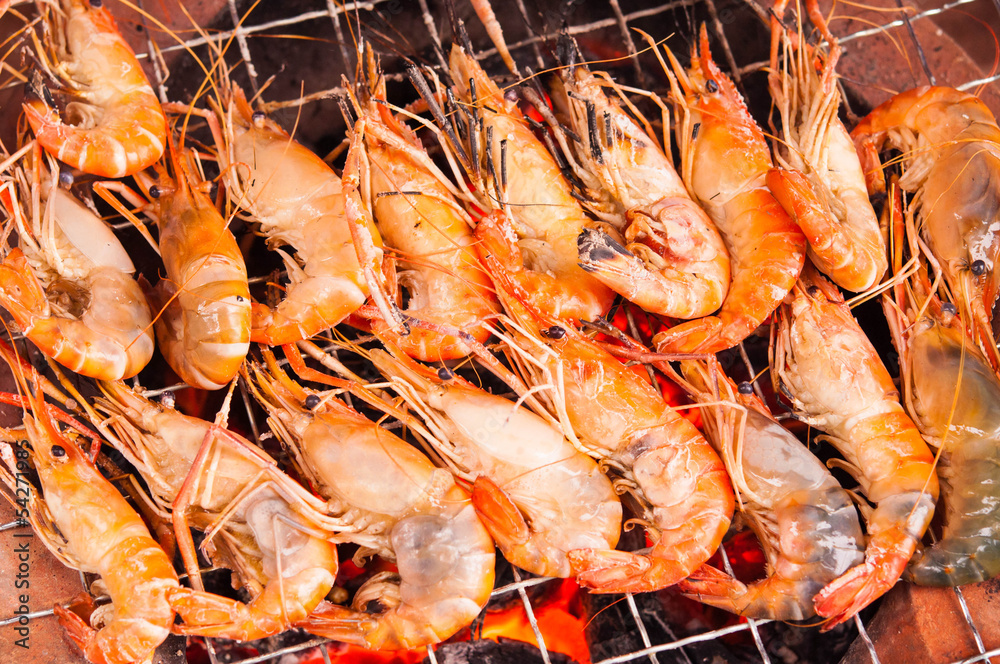 grilled prawns on flaming grill grilled prawns on flaming grill