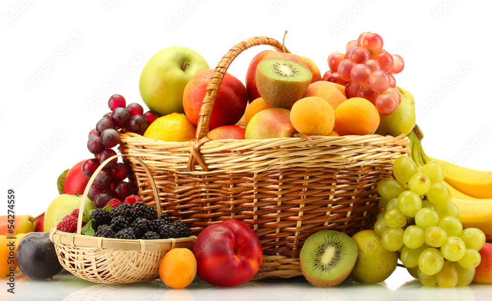 Assortment of exotic fruits and berries in baskets isolated Assortment of exotic fruits and berries in baskets isolated