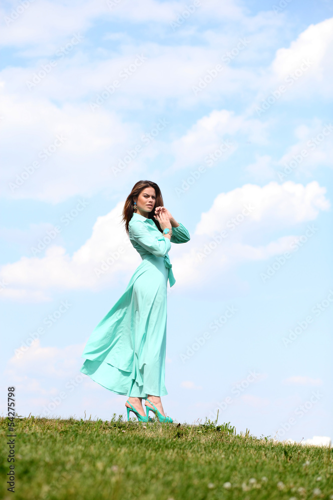 Attractive young woman in green dress Attractive young woman in green dress