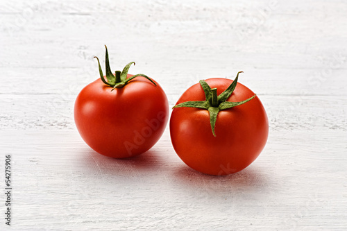 Two small ripe red tomatoes