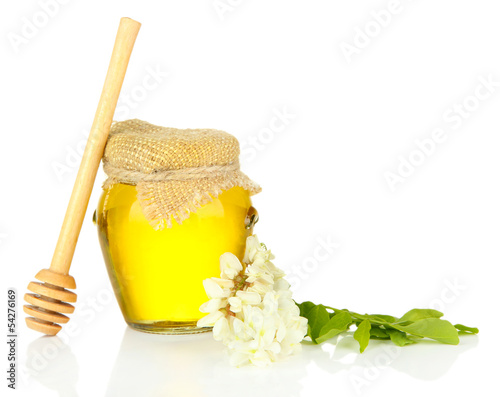 Jar of honey with flowers of acacia, isolated on white