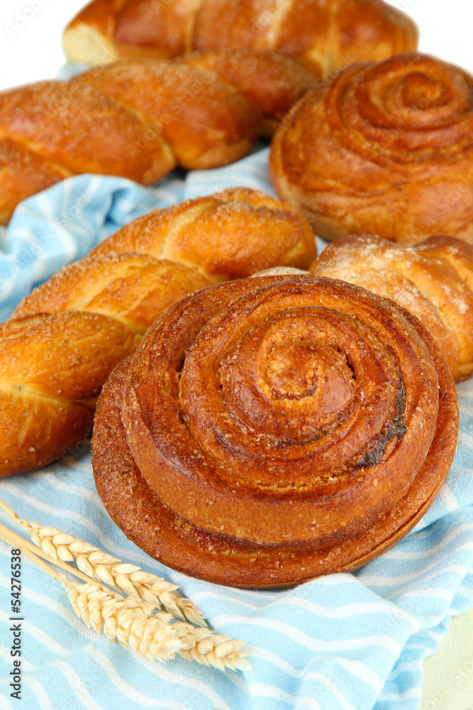 Fototapeta premium Composition with buns, on color napkin, close up
