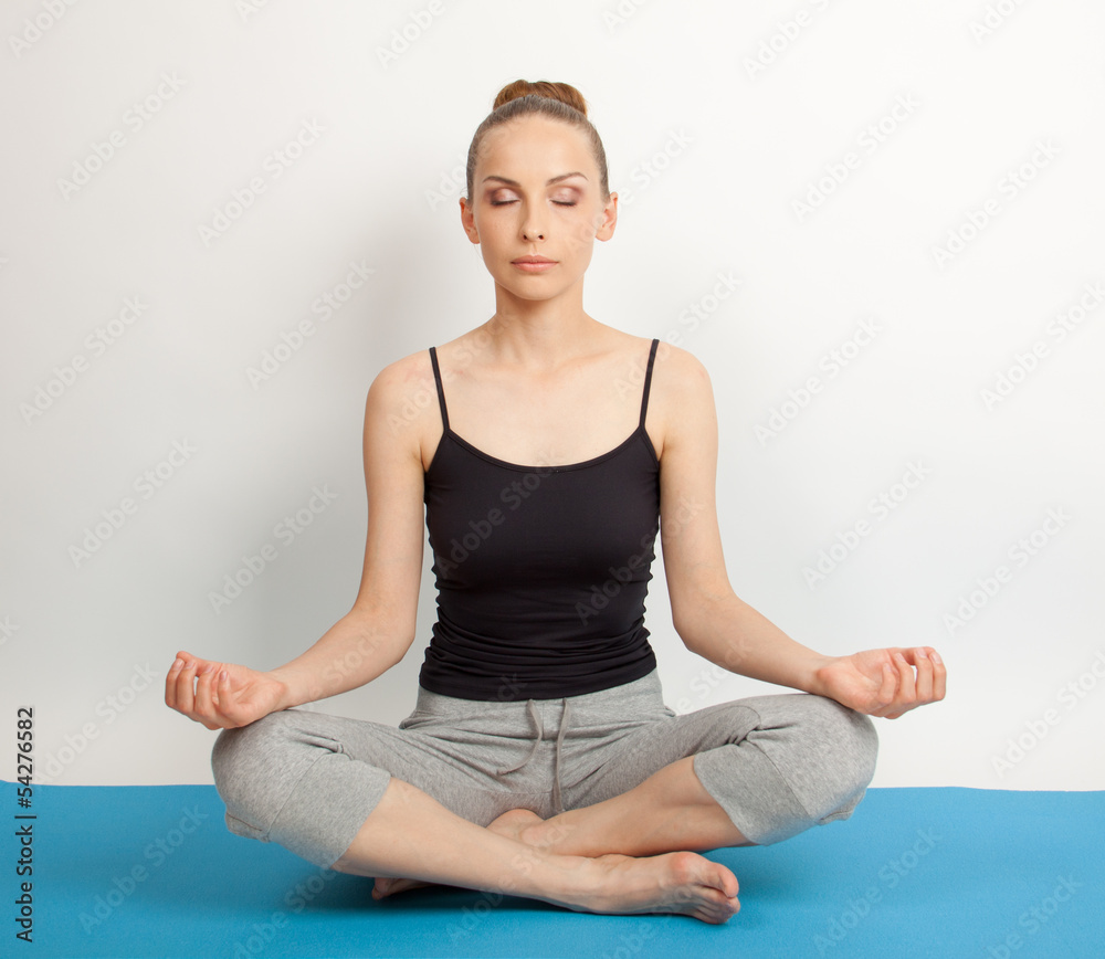woman meditating in pose of lotus on white background woman meditating in pose of lotus on white background