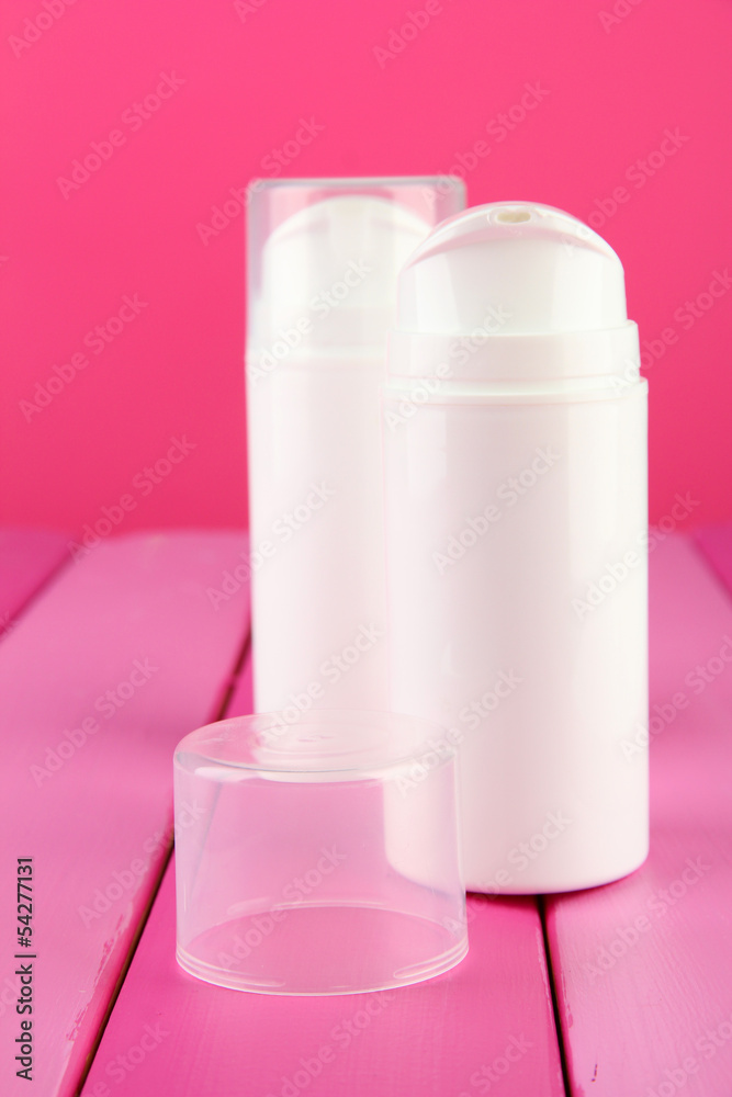 Bottle with cream, on color background Bottle with cream, on color background