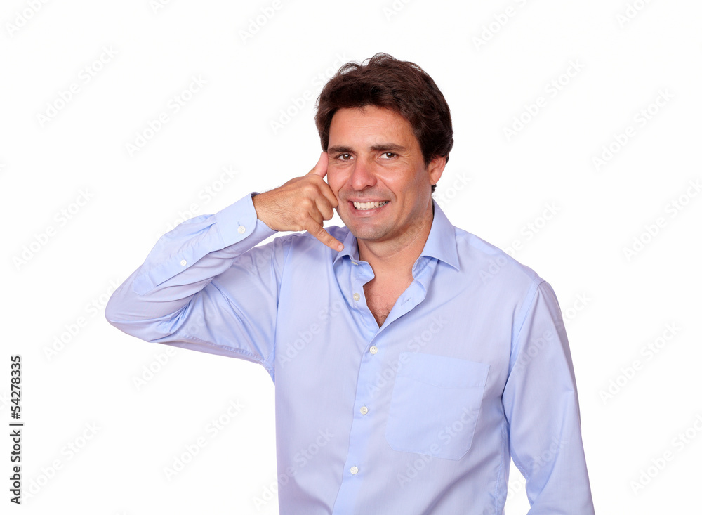 Charming latin man gesturing a call with hand Charming latin man gesturing a call with hand
