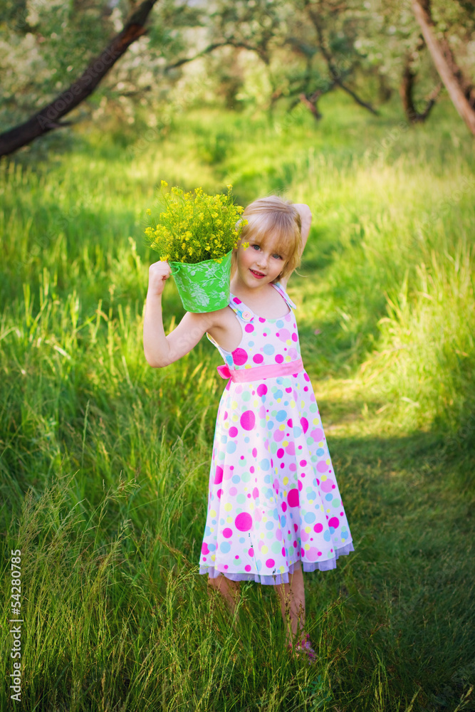 Little girl holding a bucket of flowers on shoulder Little girl holding a bucket of flowers on shoulder