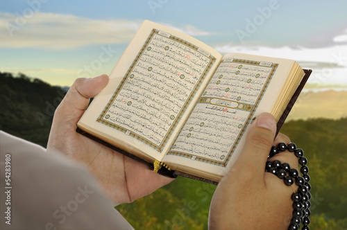 Young Man Reading The Holy Koran