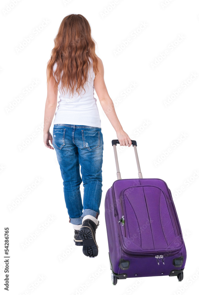 back view of walking woman with suitcase back view of walking woman with suitcase