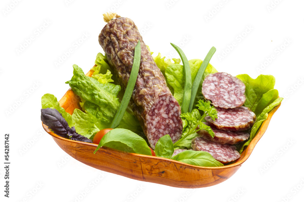 Ripe salami with salad, basil, onion and tomato Ripe salami with salad, basil, onion and tomato