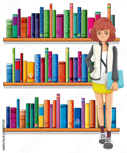 A lady holding a book standing in front of the bookshelves