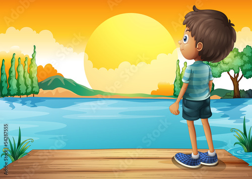 A boy watching the sunset
