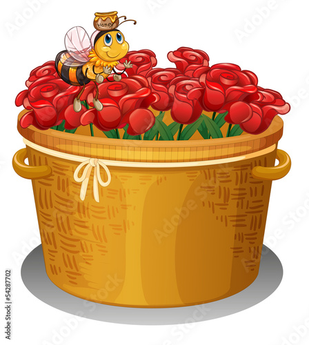 A bee at the basket full of red roses