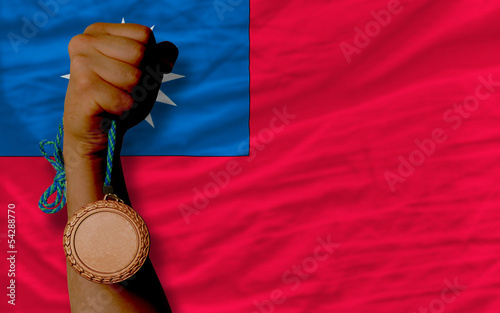 Bronze medal for sport and  national flag of taiwan photo