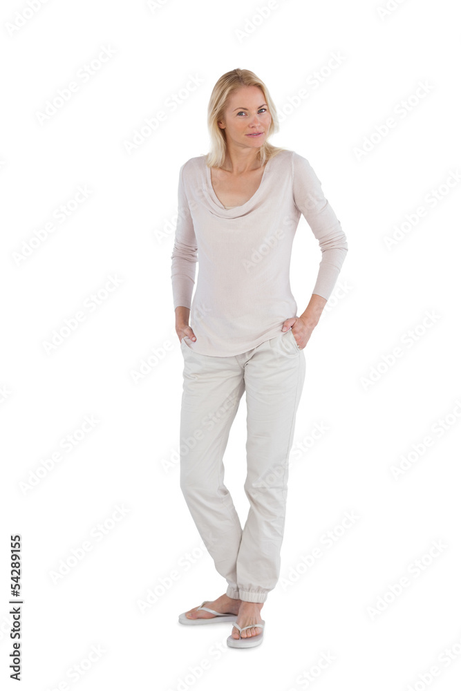 Peaceful woman with hands in pockets