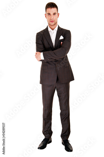 Young handsome man in black suit and glasses smiling isolated