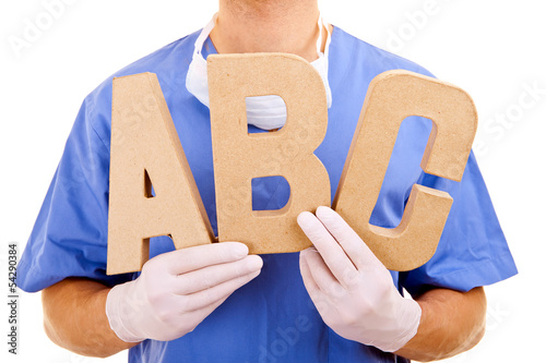 Young doctor holding letters a b c photo