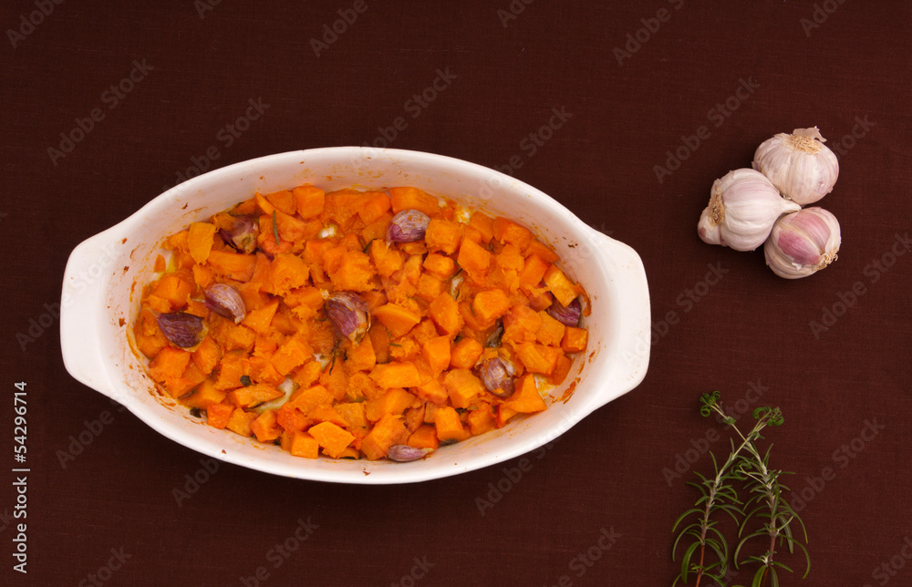 Baked pumpkin with garlic, olive oil and rosemary. Baked pumpkin with garlic, olive oil and rosemary.