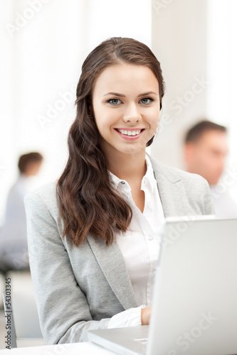 businesswoman with laptop computer at work