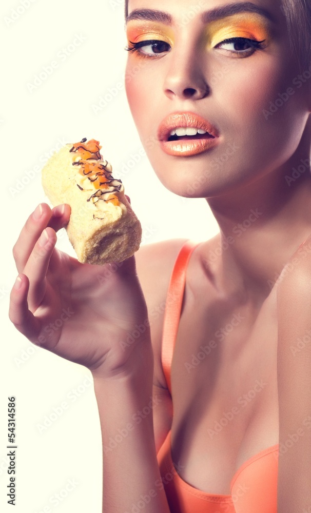 Beautiful fashion girl with delicious orange praline Beautiful fashion girl with delicious orange praline
