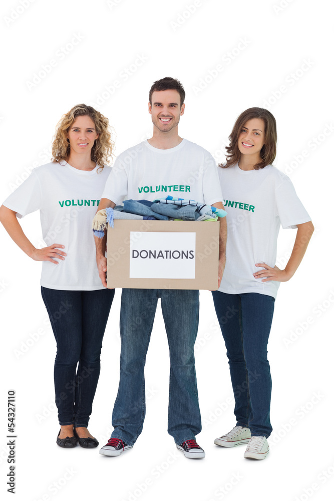 Obraz premium Group of volunteers holding donation box with clothes