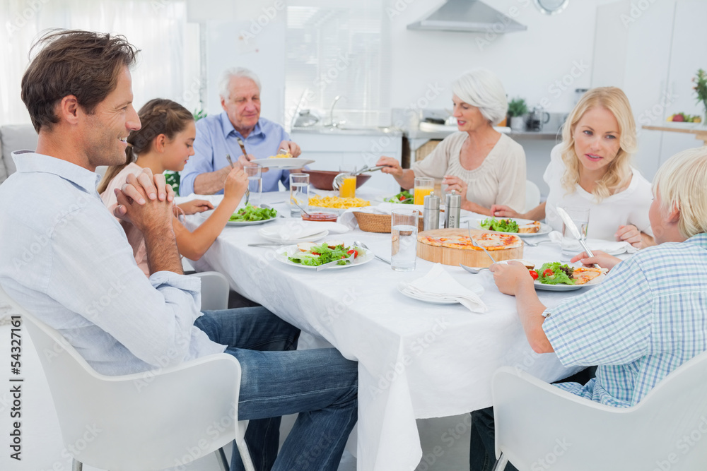 Extended family at the dinner table Extended family at the dinner table