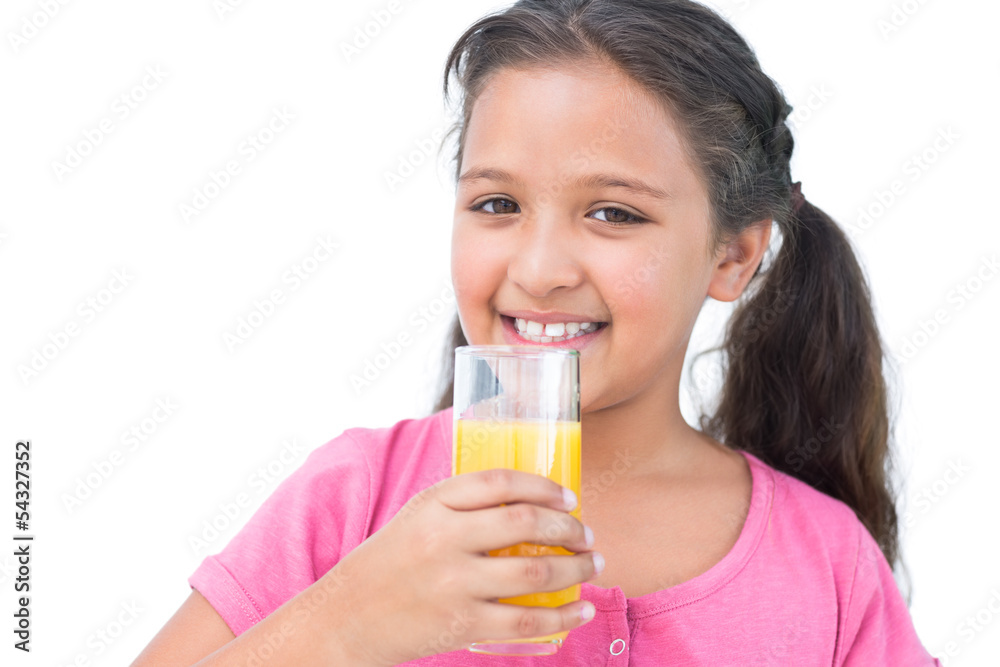 Smiling little girl drinking orange juice Smiling little girl drinking orange juice