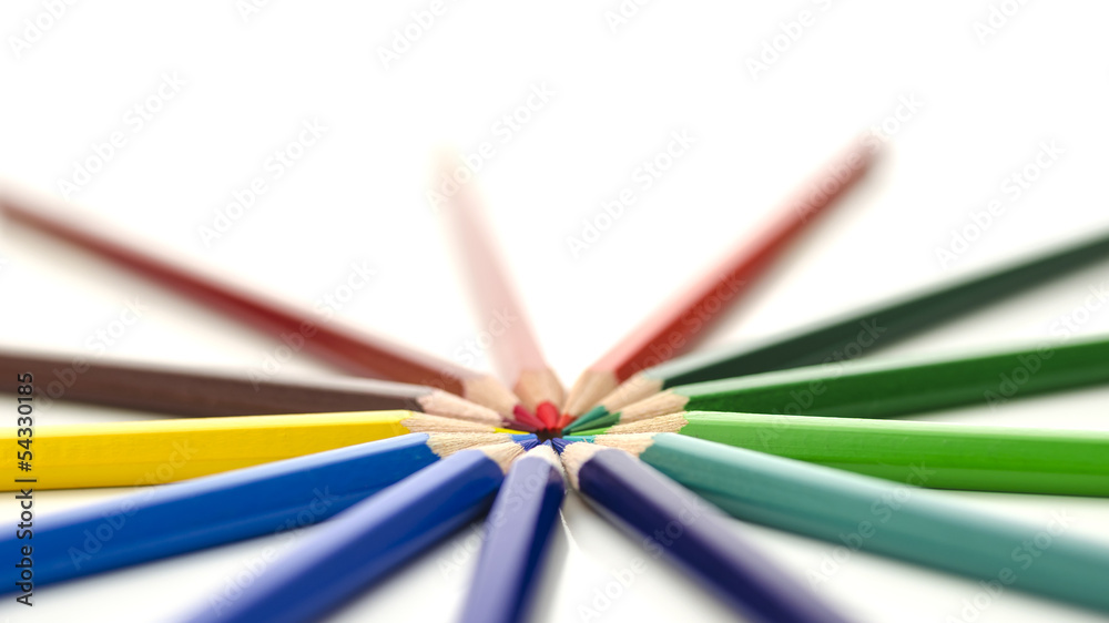 Fototapeta premium Colored pencils pointing in circle