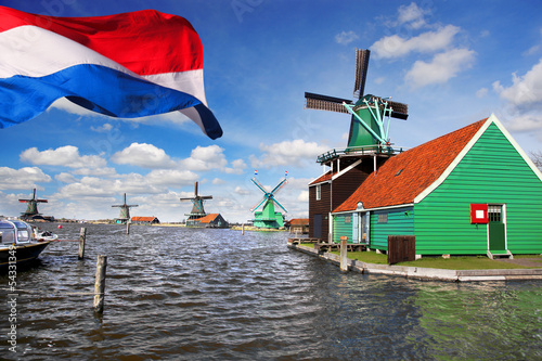 Photography Windmills with flag of Holland in Zaanse Schans