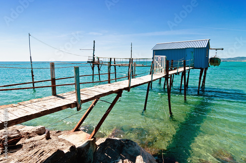 Canvas Print blue fishermen hut on Tuscany coast