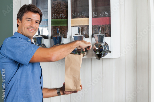 Man Buying Coffee Beans At Grocery Store
