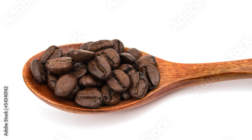 Coffee beans in a wooden spoon isolated