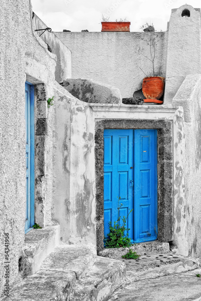Fototapeta premium Old house with blue traditional door in Pyrgos