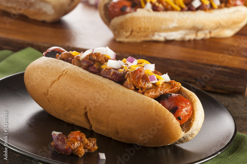 Homemade Hot Chili Dog with Cheddar Cheese photo