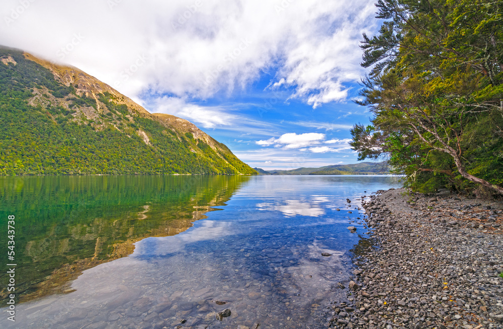 White Clouds and Blue Sky over an Alpine Lake White Clouds and Blue Sky over an Alpine Lake
